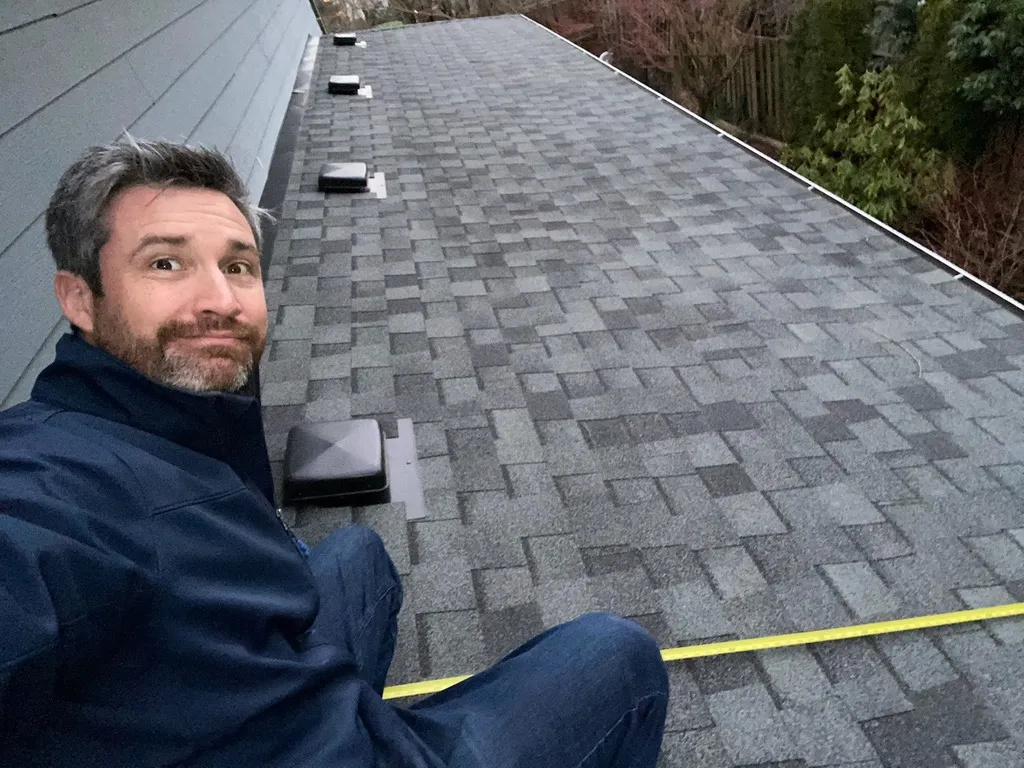 Sunward Power founder Chris Middlebrooks on a roof installation
