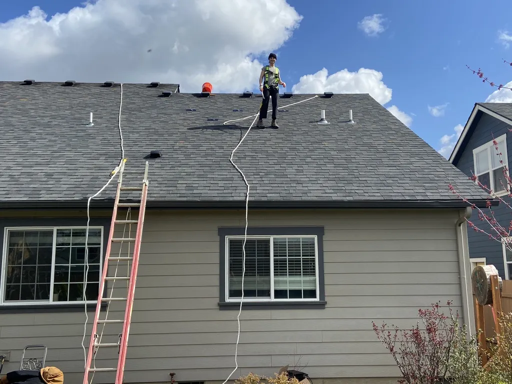 Crew starting a rooftop solar installation